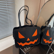 Halloweenová taška cez rameno s dizajnom tekvice v čiernej a oranžovej farbe – Norevia