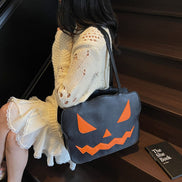 Halloweenová taška cez rameno s dizajnom tekvice v čiernej a oranžovej farbe – Norevia