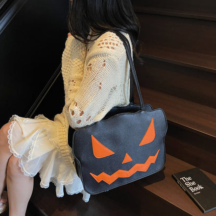 Halloweenová taška cez rameno s dizajnom tekvice v čiernej a oranžovej farbe – Norevia