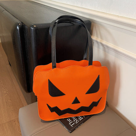 Halloweenová taška cez rameno s dizajnom tekvice v čiernej a oranžovej farbe – Norevia