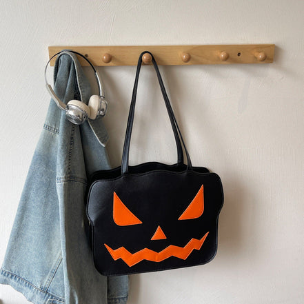 Halloweenová taška cez rameno s dizajnom tekvice v čiernej a oranžovej farbe – Norevia