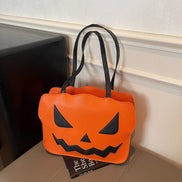 Halloweenová taška cez rameno s dizajnom tekvice v čiernej a oranžovej farbe – Norevia