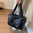 Sorina skuldertaske med rummelig indretning