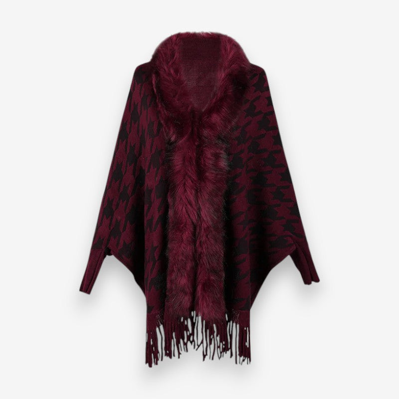 Stellara poncho med krave og stjernemønster