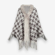 Stellara poncho med krave og stjernemønster