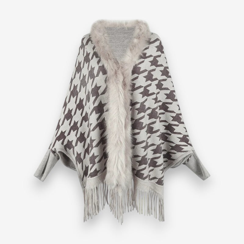 Stellara poncho med krave og stjernemønster