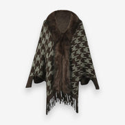 Stellara poncho med krave og stjernemønster