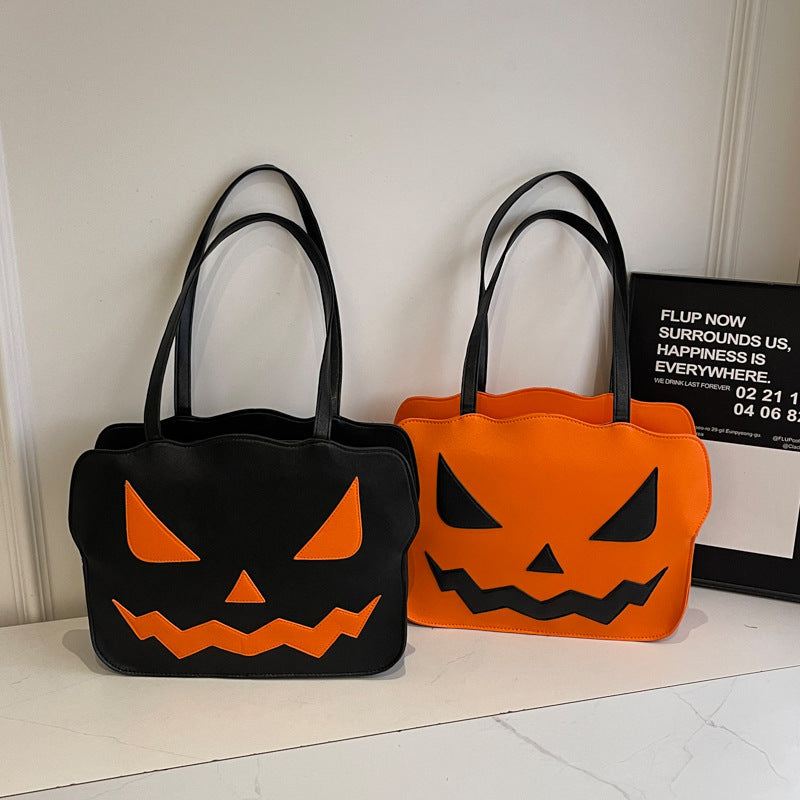 Halloweenová taška cez rameno s dizajnom tekvice v čiernej a oranžovej farbe – Norevia