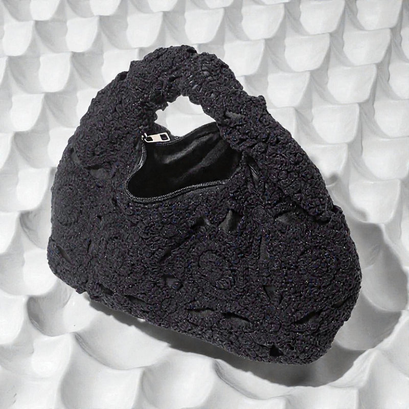 Arvella handbag med udskåret mønster