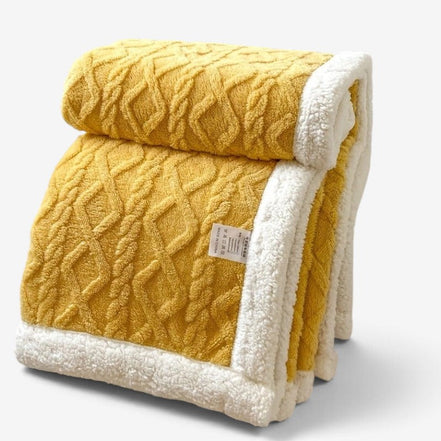 Vendbart fleecetæppe med mønstret design – Blankora